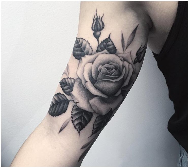 Beautiful rose tattoo on biceps