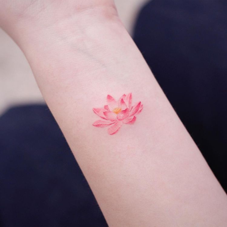 Pink mini lotus tattoo