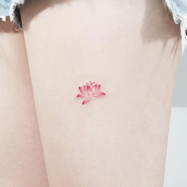 Mini lotus tattoo pattern on thigh